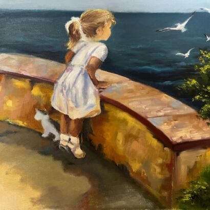 A girl looks at the sea
