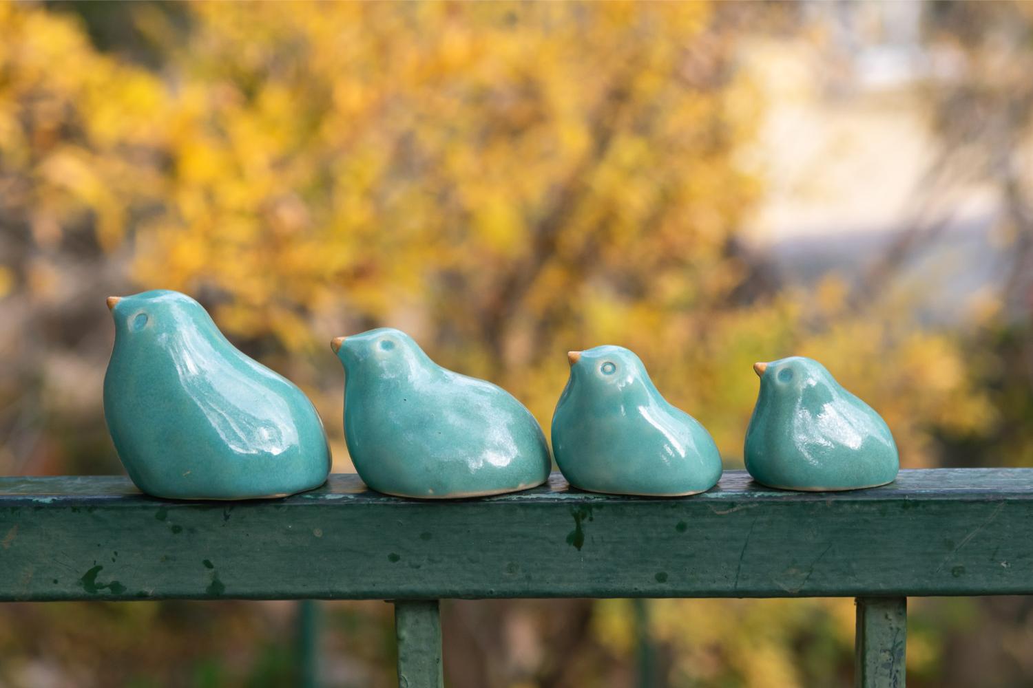 Family of turquoise birds in a nest - Image 2